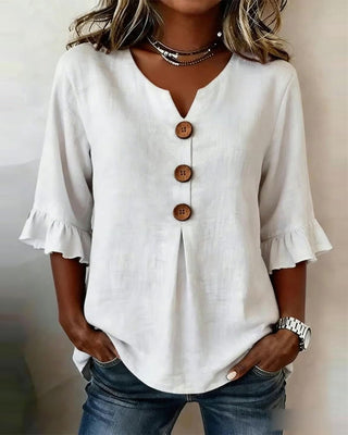 Blusa Sofía de algodón-lino lisa con botones de madera y volantes