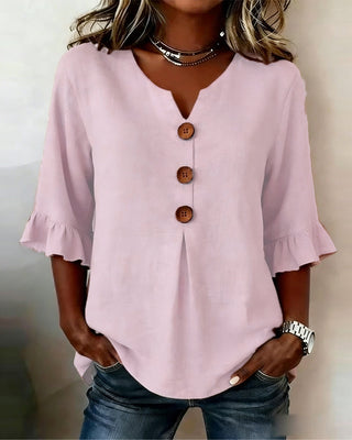Blusa Sofía de algodón-lino lisa con botones de madera y volantes