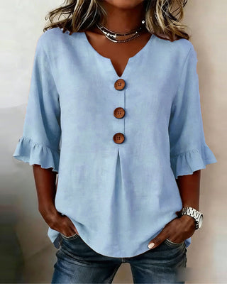 Blusa Sofía de algodón-lino lisa con botones de madera y volantes